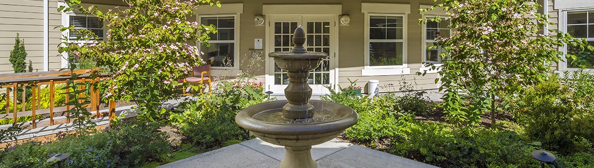 A fountain in the center of an outdoor patio