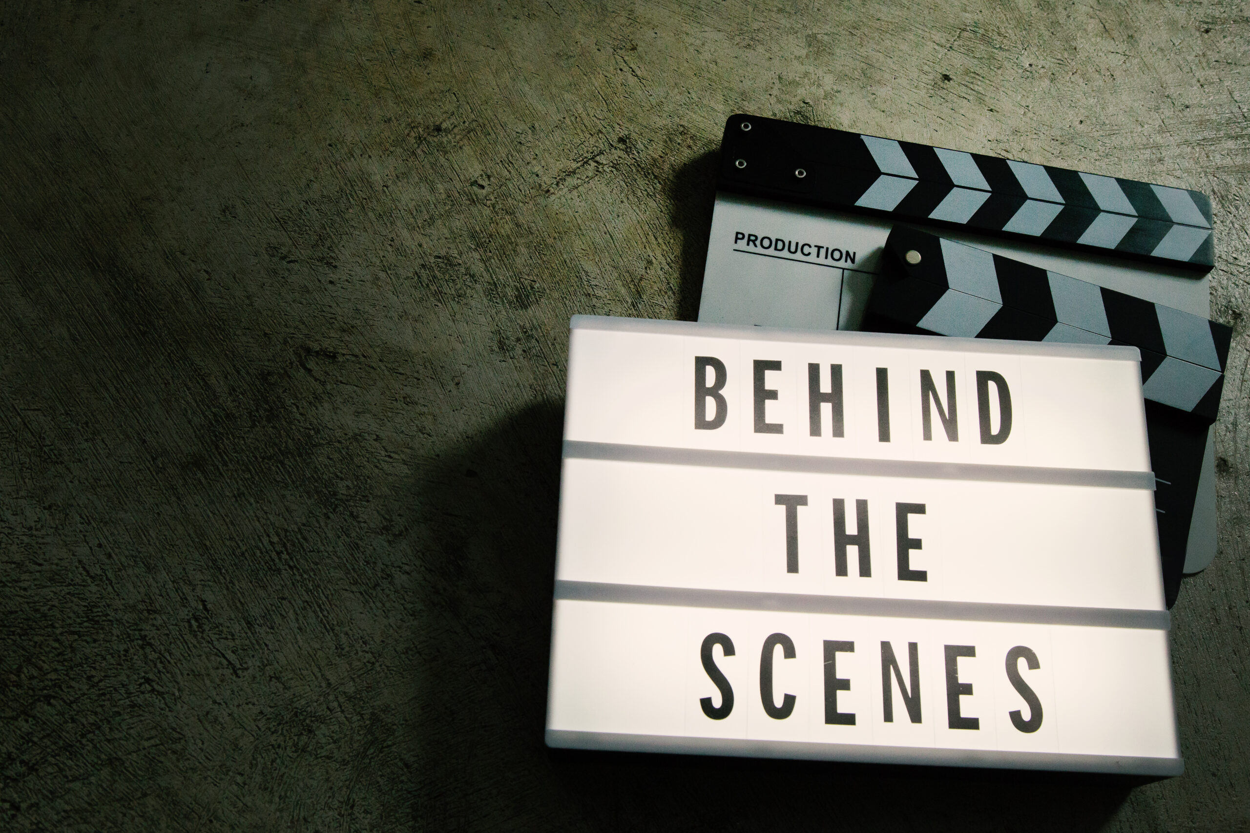 The text, "Behind the scenes