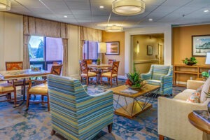 A social activities room couches, chairs and tables for residents