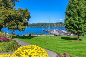 A view of the walkway leading down to a dock with boats tied up