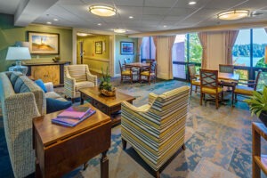 A Covenant Living social activity room with couches, chairs and tables for gathering