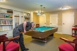 A resident playing billiards alone